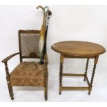 A 20th century oak barley twist occasional table, bergere armchair, three assorted canes and