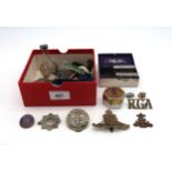 An small assortment of collectable odds, incorporating a Royal Artillery cap badge, Royal Garrison