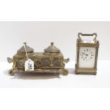 A brass and glass carriage clock together with a brass inkwell Condition Report:Available upon