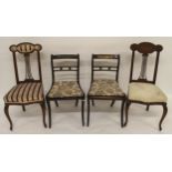 A pair of Victorian mahogany framed dining chairs and a further pair of sabre legged dining