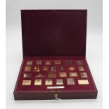 A cased set of silver gilt stamp ingots of the British Empire, by Hallmark Replicas Ltd, 471gms