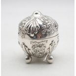 A Victorian silver string box, of typical form, with embossed decoration of shells and flowers, on