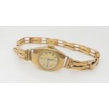 A 9ct gold ladies Record watch with inscription to the back of the case weight including mechanism