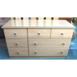 A contemporary pine veneered bank of seven drawers, 72cm high x 122cm wide x 45cm deep Condition