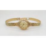 A 9ct gold retro ladies Volvo watch and strap, weight including mechanism 15.6gms Condition Report: