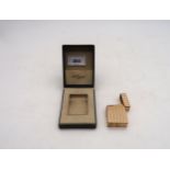 A Dupont gold-plated flip top cigarette lighter, in original box Condition Report:Available upon