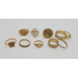 Three 9ct gold wedding bands, a faux coin ring and six further 9ct rings, weight combined 26.8gms