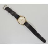 A 9ct gold Garrard gents watch, with a leather strap, weight including mechanism 37.1gms Condition