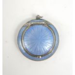 A RUSSIAN SILVER GUILLOCHE ENAMEL COMPACT of circular form, with cornflower blue enamel