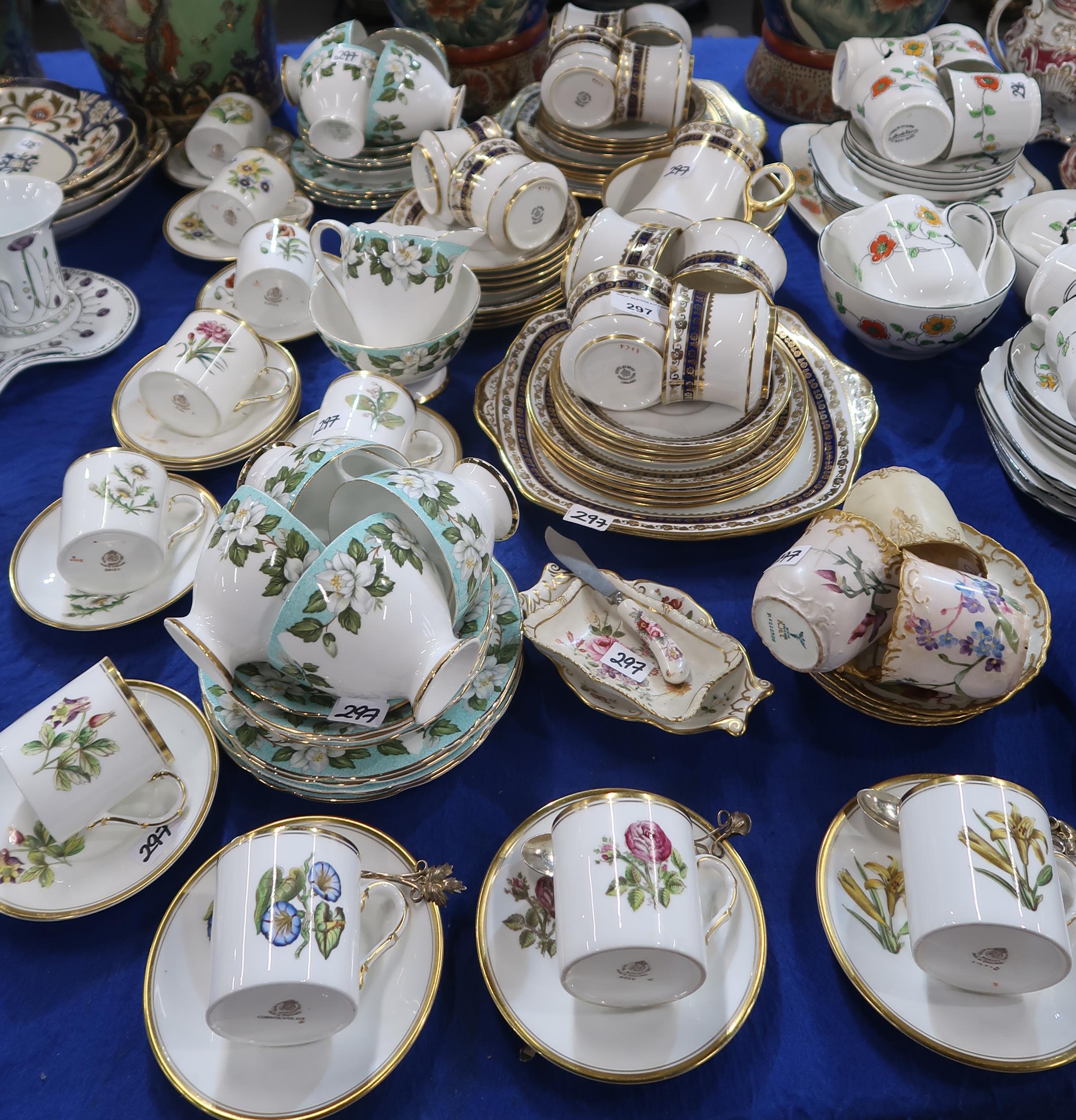 A set of ten Royal Worcester coffee cans and saucers all decorated with different flowers, two extra