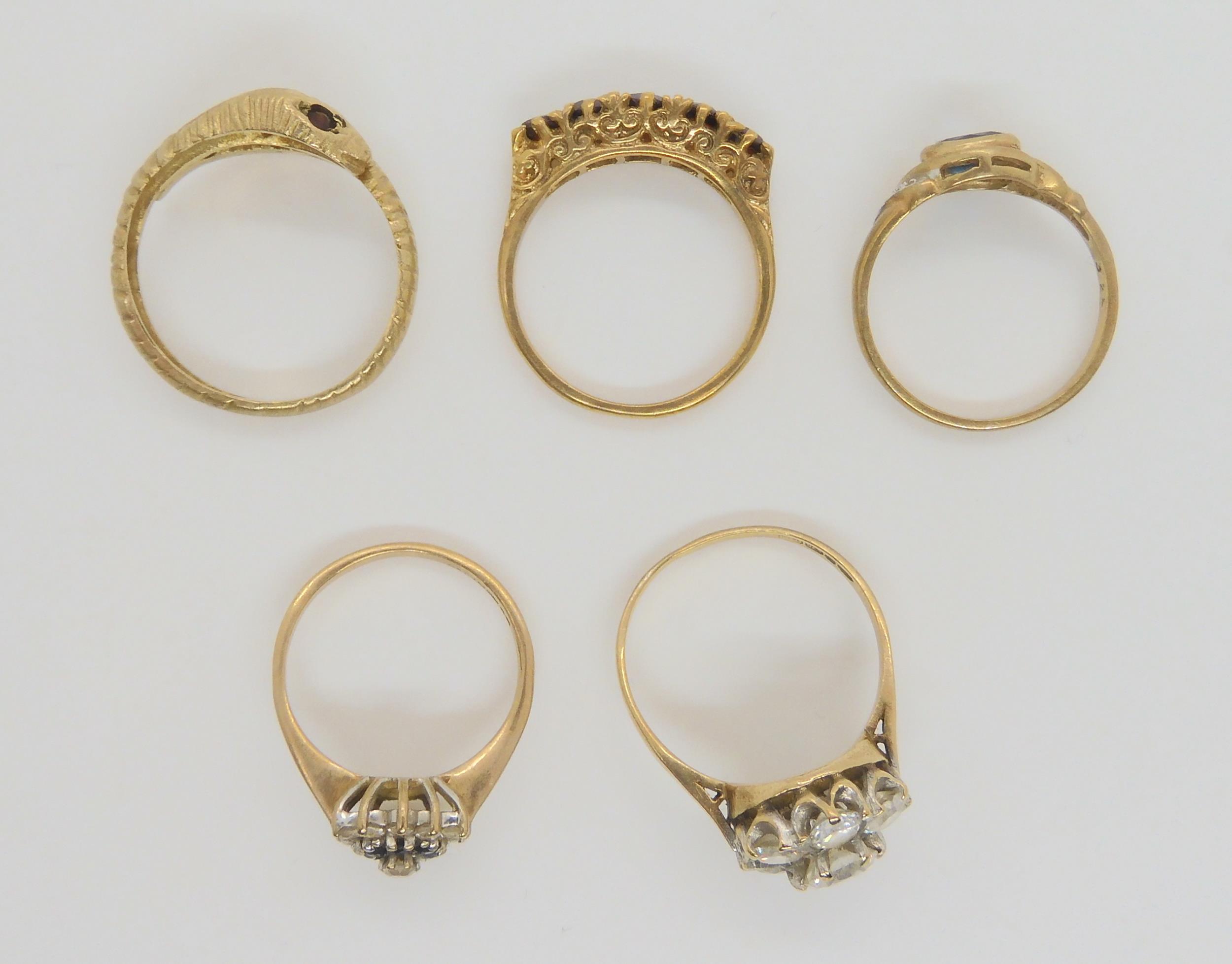 five 9ct gold gem set rings, to include a snake ring with garnet eyes, size P1/2, a five stone - Image 3 of 4