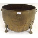 A 19th century brass twin handled log bin on paw feet, 39cm high x 62cm diameter Condition Report: