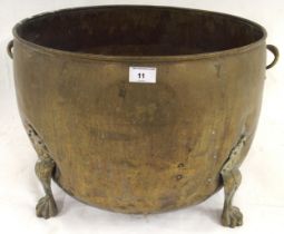 A 19th century brass twin handled log bin on paw feet, 39cm high x 62cm diameter Condition Report: