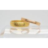 A 22ct gold wedding ring, size O, weight 4.1gms, and a 9ct example, size R1/2, weight 1gms Condition