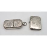 A collection of silver vestas including a combination vesta and sovereign holder, the body with