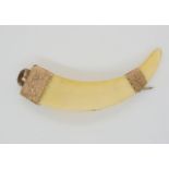 A yellow metal and citrine mounted boar's tusk, length 8.7cm, weight 13.5gms Condition Report: