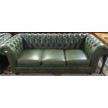 A 20th century green leather upholstered Chesterfield style three seater button back club settee