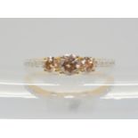 A 9ct gemsTV champagne and white diamond ring, set with estimated approx 0.75cts in total. finger