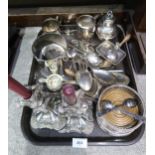 A collection of EPNS including wine coasters, mugs, butter dishes, loose serving spoons, a pair of