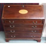 A 19th century mahogany writing bureau with fitted fall front writing compartment over four