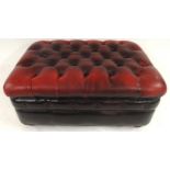 A 20th century red leather button upholstered Chesterfield style ottoman footstool, 41cm high x 90cm