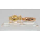 A 9ct gold buckle ring, with Chester Hallmarks for 1910, together with a 9ct rose gold wedding ring,