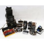 A leather-cased Butcher's Popular Pressman plate camera, together with various vintage cameras and