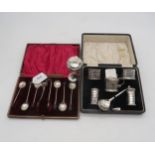 A collection of silver including a cased silver cruet set, with blur glass liners, (preserve pot