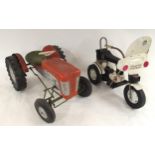 A child's Triang peddle powered tractor and a child's Pines traffic patrol battery operated trike (