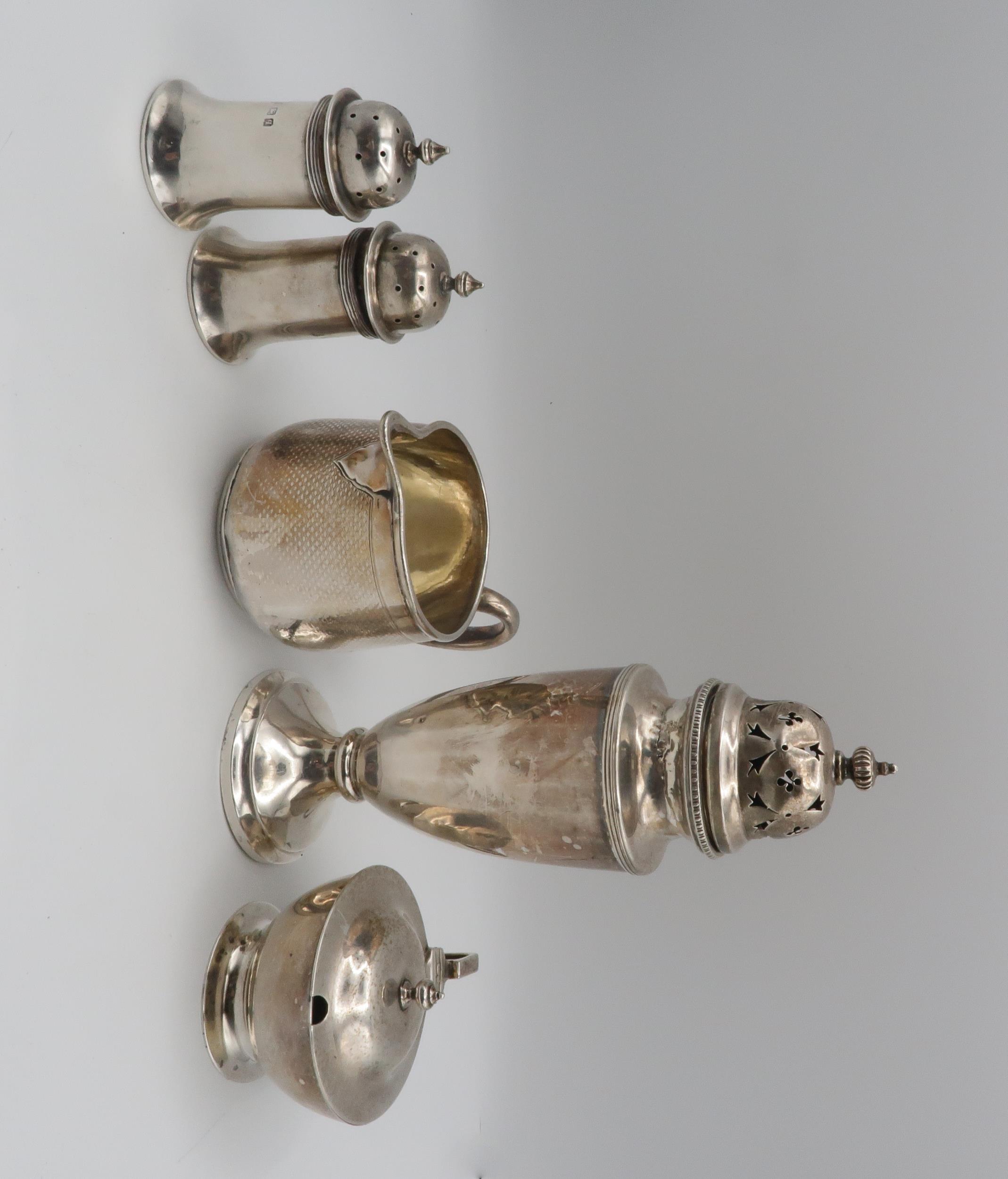 A collection of silver including a Victorian silver cream jug, the body with engine turned