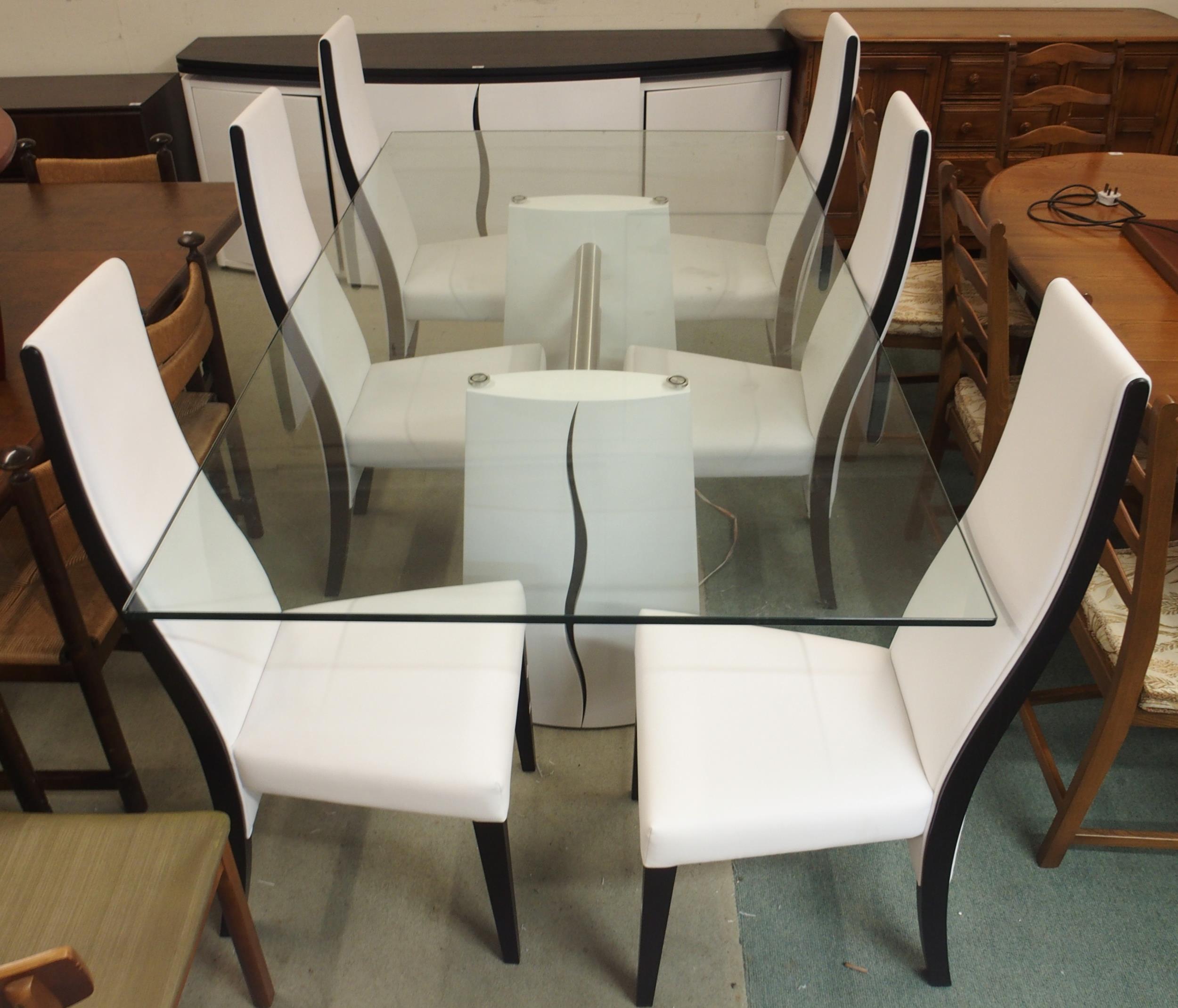 A contemporary Aleal glass top dining table, 78cm high x 215cm long x 115cm wide and six white