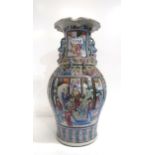 A Chinese famille rose canton vase, of baluster form with a pie crust rim, decorated with panels