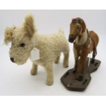 An early-C20th toy horse, constructed of pony/cow hide, on a wheeled pine base, measuring approx.