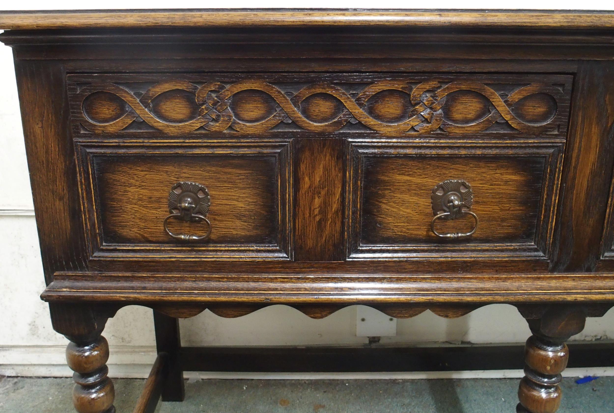 A 20th century oak baronial style two drawer buffet table on stretchered bobbin turned supports, - Image 2 of 5