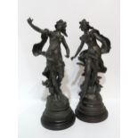 A pair of French spelter figures of maidens, after Moreau, on wooden bases, 44cm high Condition