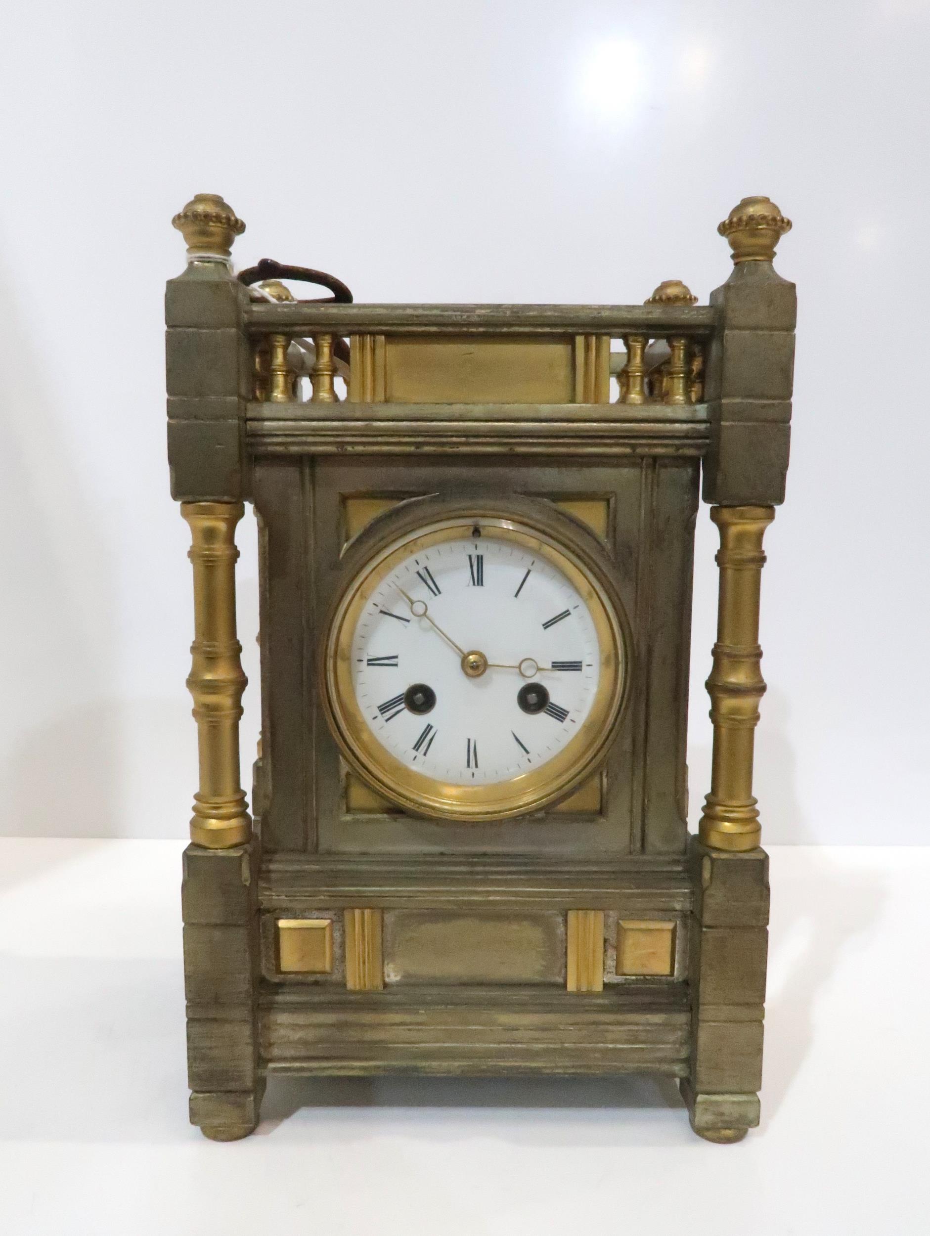 A gilded metal Howell James mantle clock, the movement stamped and with number 790 Condition