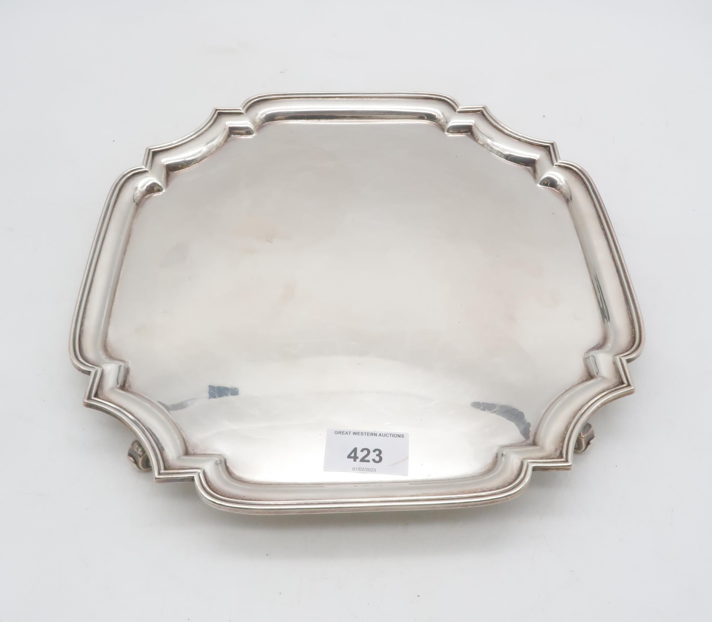A silver salver, of canted form, on four scroll feet, by Adie Brothers Ltd, Birmingham 1939,