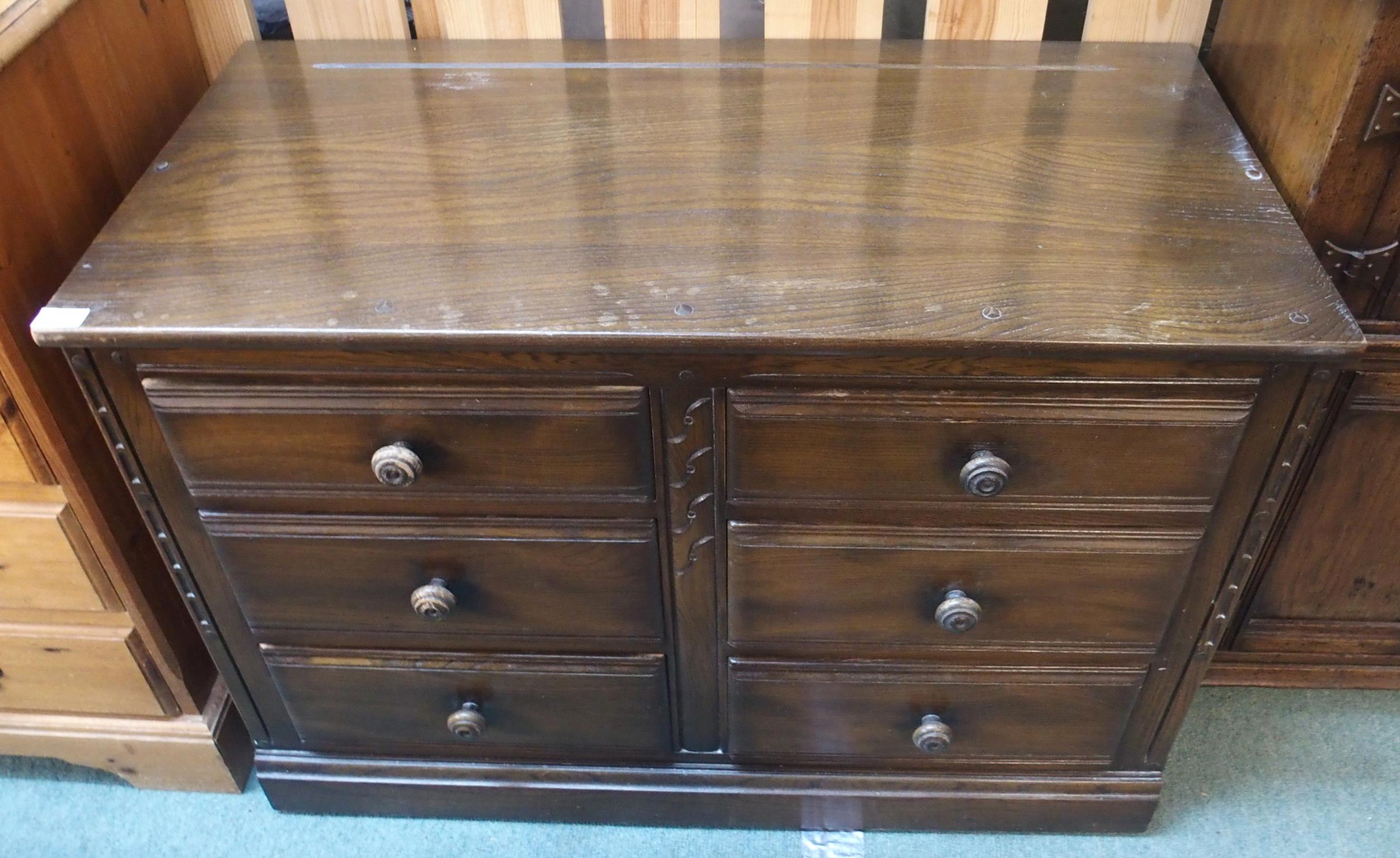 A mid 20th century elm and beech Ercol chest of six drawers, 70cm high x 98cm wide x 49cm deep