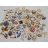 A collection of vintage costume jewellery brooches to include items by Hollywood, Ciro, etc