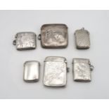 A collection of silver vestas including one with an embossed equestrian scene, by William J