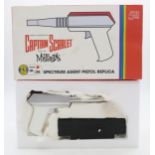A Captain Scarlet Spectrum Agent Pistol 50th Anniversary edition by Planet Replicas, together with