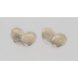 A pair of white metal engine turned engraved cufflinks, stamped 18k to the back of the cufflinks and
