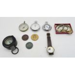 A mixed lot, comprising a WW2-era military compass, a civilian example, an Ingersoll pocket watch,