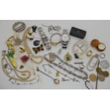 A collection of costume jewellery to include a Black & white Whisky dog brooch, Watches and other