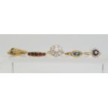 five 9ct gold gem set rings, to include a snake ring with garnet eyes, size P1/2, a five stone