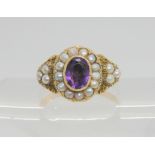 A bright yellow metal Victorian style ring set with amethyst and pearls, size R1/2, weight 4.1gms