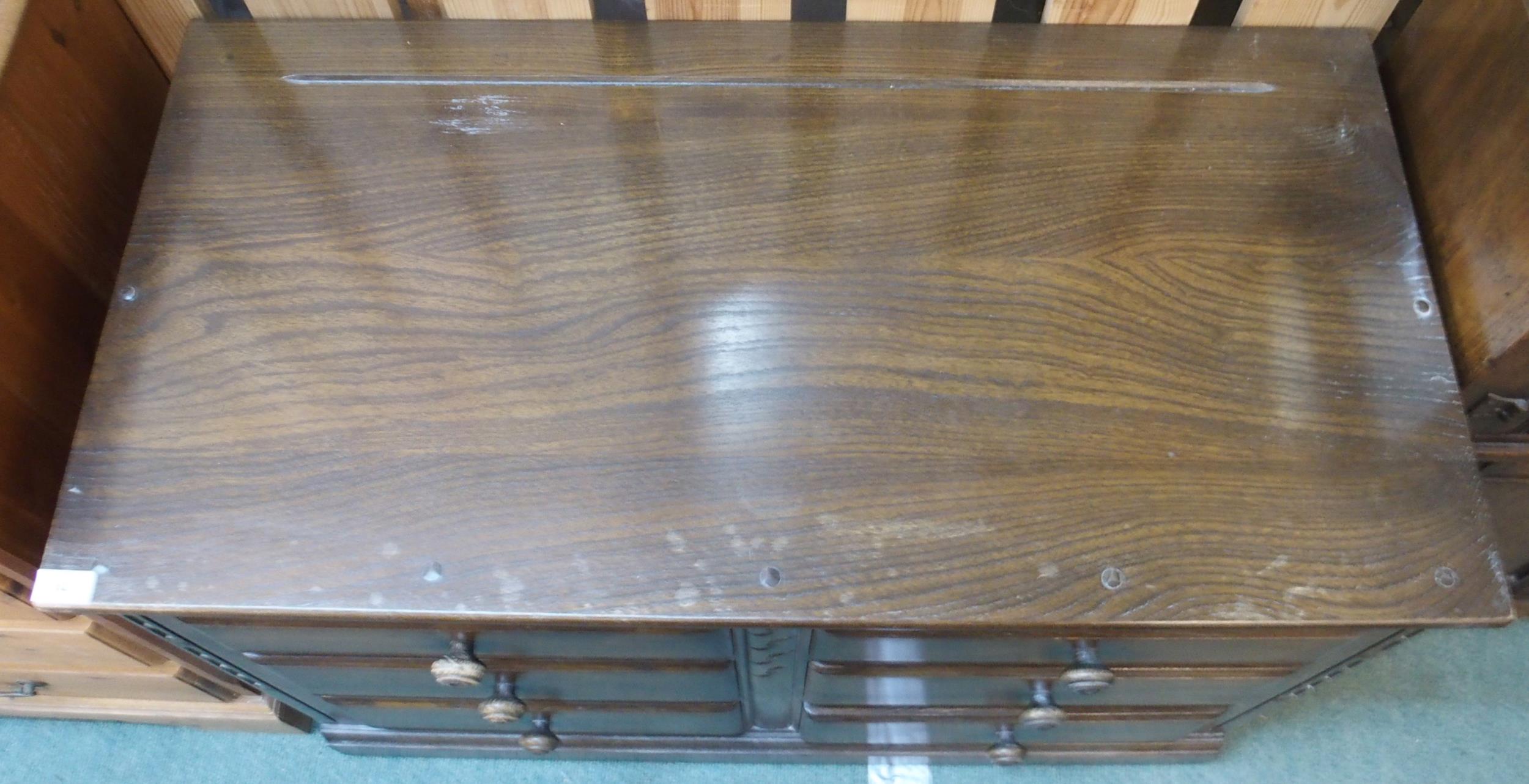 A mid 20th century elm and beech Ercol chest of six drawers, 70cm high x 98cm wide x 49cm deep - Image 4 of 4