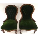 A lot of two Victorian walnut framed button back upholstered spoon back nursing chairs (2) Condition