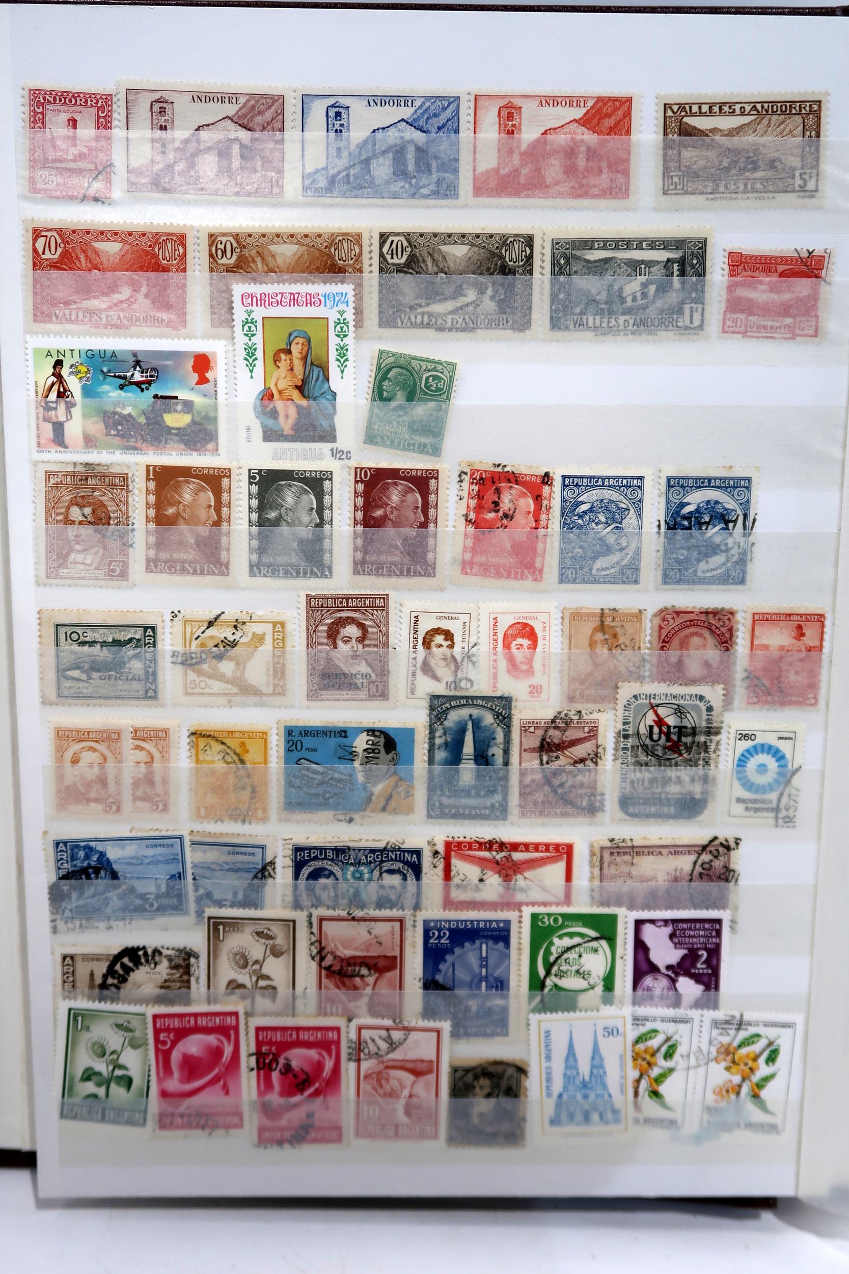 STAMPS a large world collection of mainly used stamps in eight albums plus five stock books, large