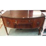 A 20th century mahogany bow front sideboard with two central drawers flanked by cabinet doors on